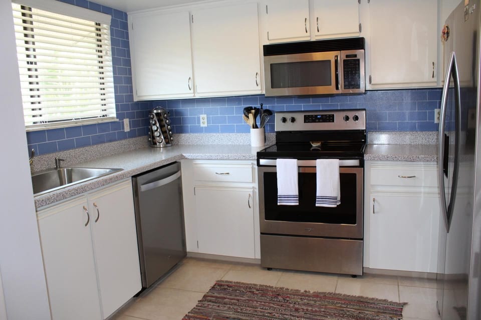 Bright and open kitchen stocked with everything you need!