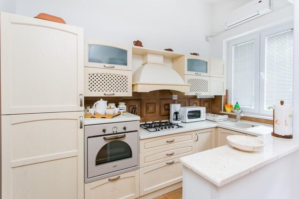 Apartment (Two-Bedroom Apartment with Terrace) | Private kitchen | Fridge, microwave, coffee/tea maker, electric kettle