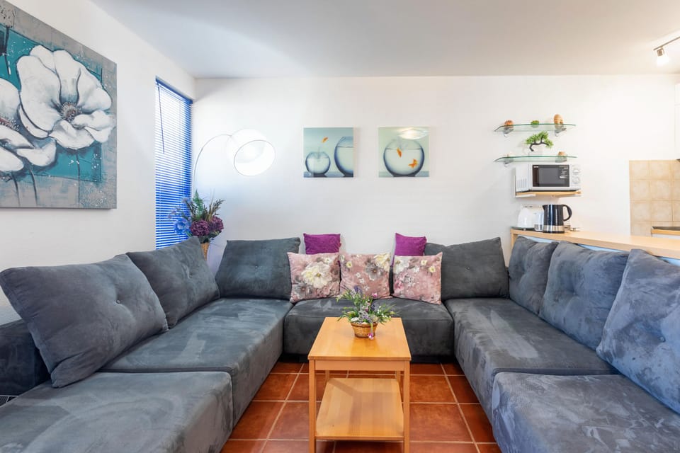 Apartment (Two Bedroom Apartment with Balcony) | Living room | Flat-screen TV