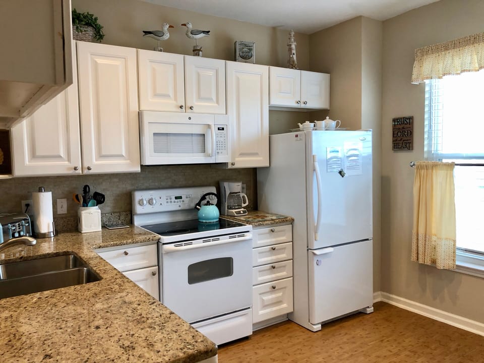 Chef's delight of a kitchen ~ equipped-to-the-hilt plus view of the pool!