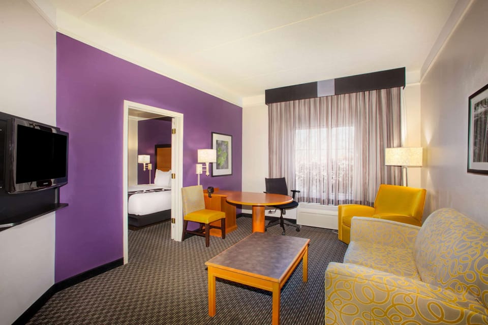 Premium bedding, desk, laptop workspace, iron/ironing board
