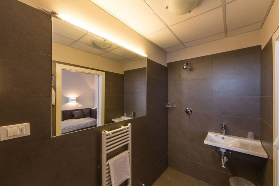 Shower, free toiletries, hair dryer, slippers