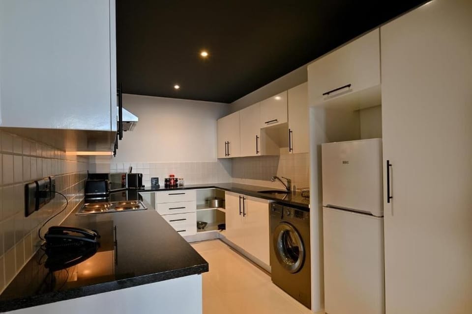 One Bedroom Apartment | Private kitchen | Coffee/tea maker, highchair, cleaning supplies
