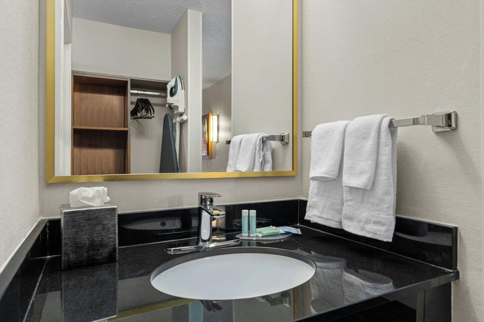 Premium bedding, desk, blackout drapes, iron/ironing board