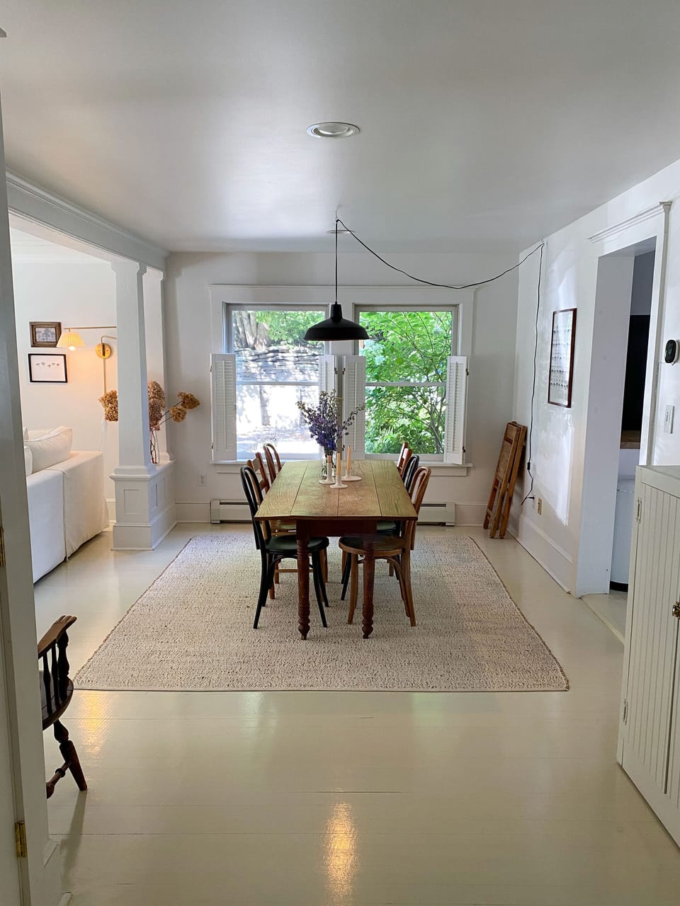 Living and dining area with gas fireplace and record player. 