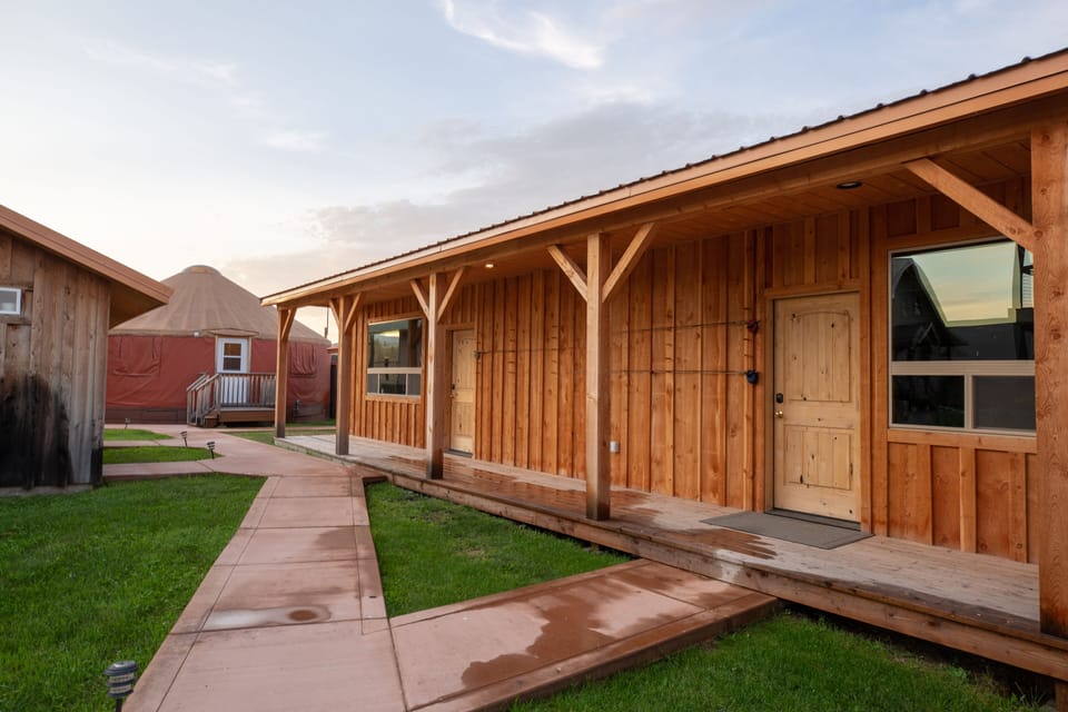 Yurt , bathhouse on left, detached bedrooms on right