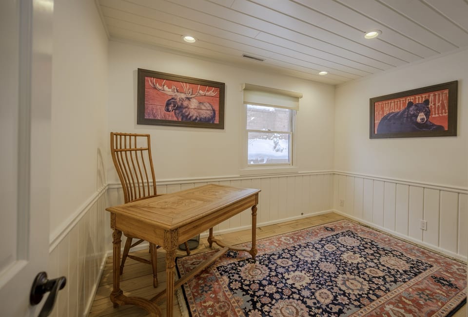 Murphy bed room can also be used as an office with unique desk and chair