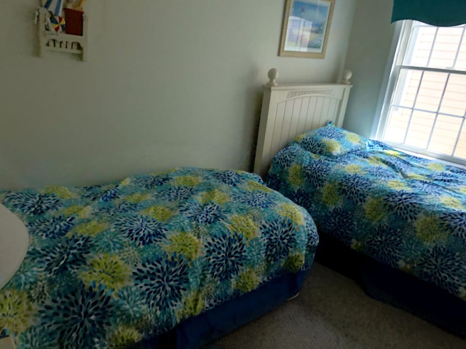 Kids room with 2 single beds.  No bunk beds to climb or fall from.  