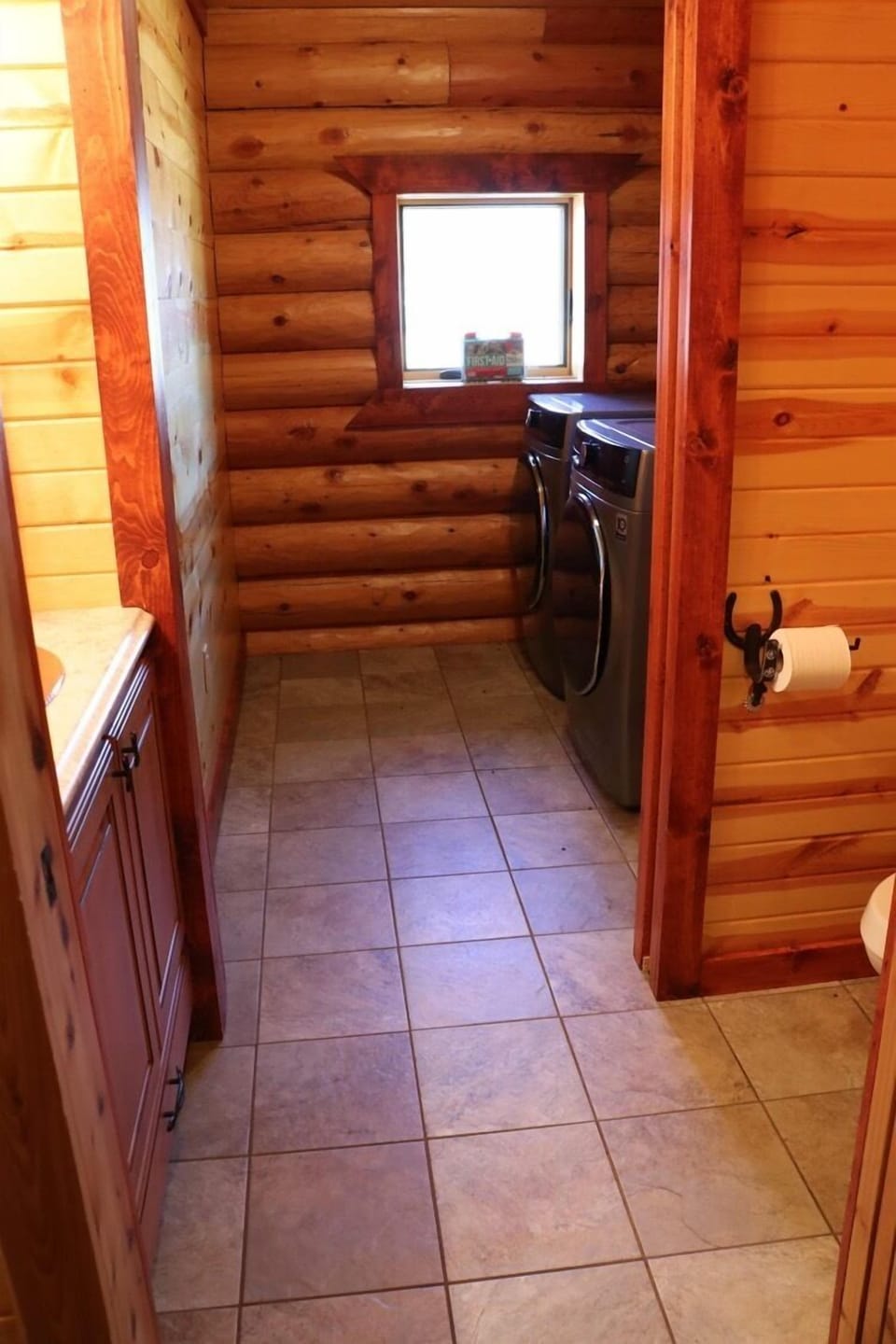 Bathroom with attached laundry room on main level 