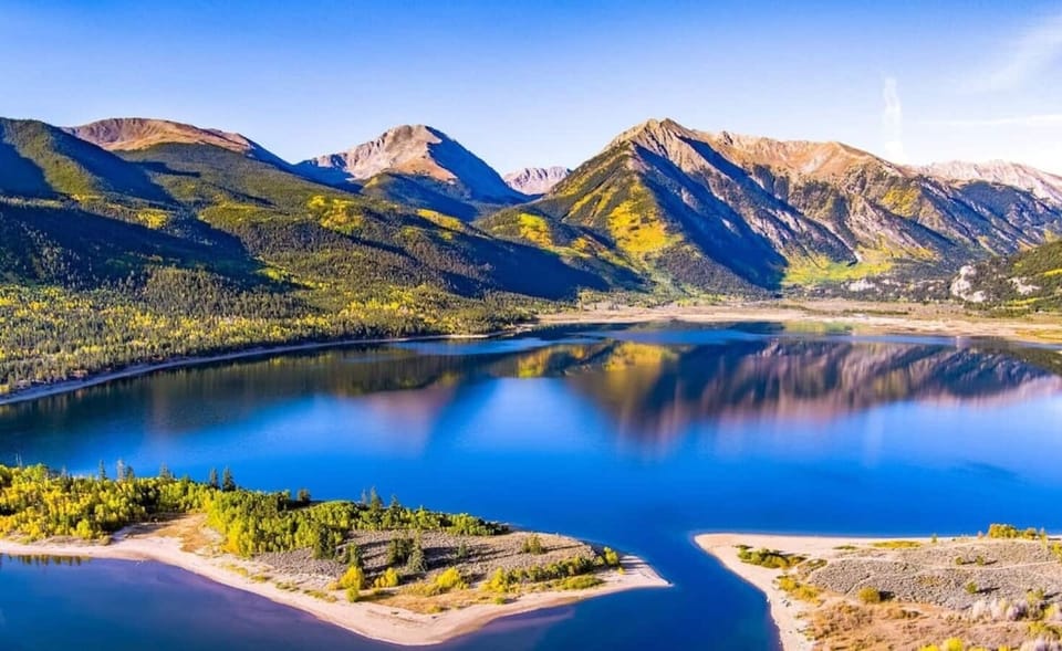 Where earth meets sky – a stunning vista of lake and mountains.