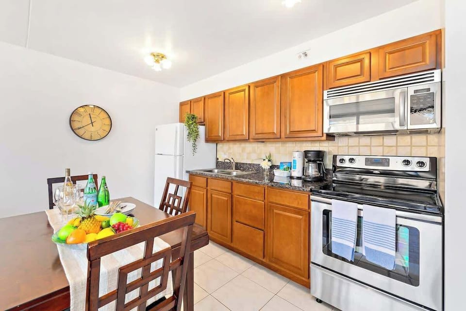 Bright kitchen with wooden cabinets and stainless steel appliances