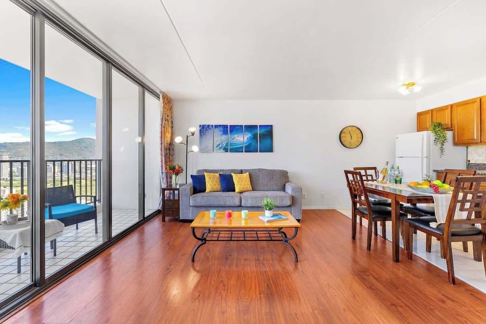 Bright living area with balcony access and mountain views