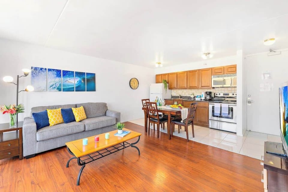 Open-concept living area with a modern kitchen and comfortable seating.