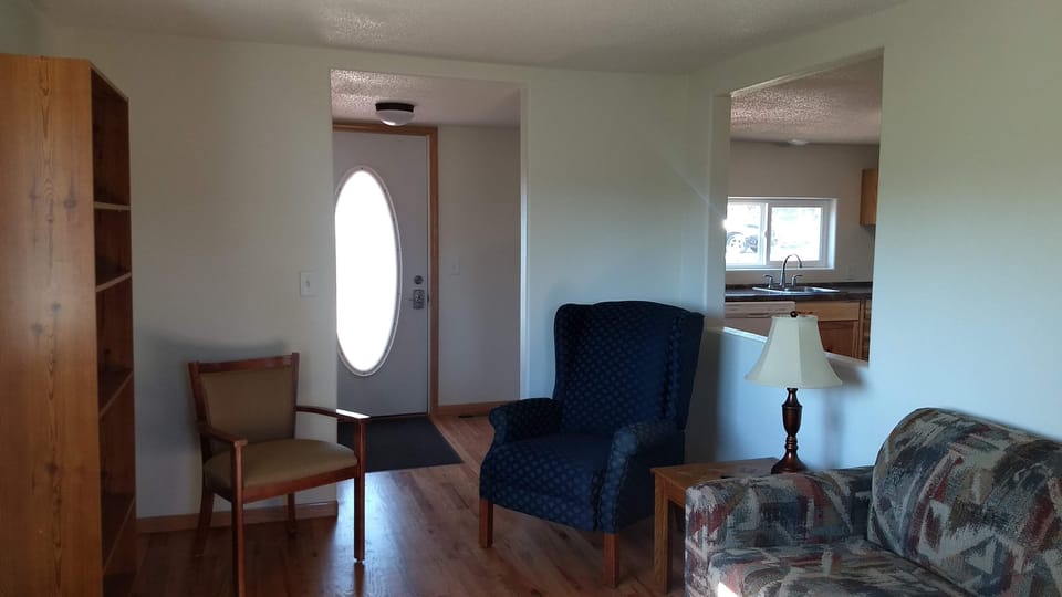 Living room with recliner, sofa sleeper, Smart TV and more.