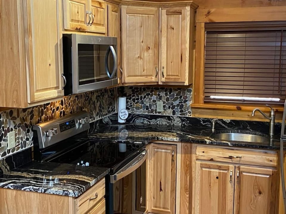 All new kitchen. Hickory cabinets, granite counters and Stainless steel appliances.