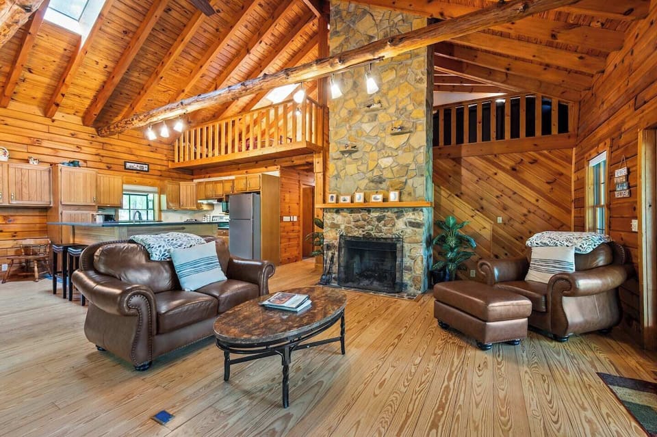 Soaring wood burning fireplace in enormous great room.