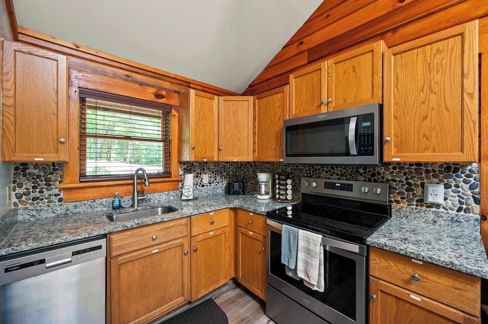 Stunning granite counters, all new stainless steel appliances and fully stocked for your home away from home.