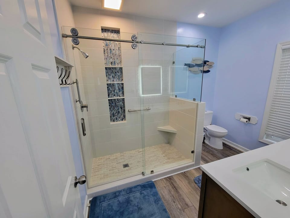 Newly renovated 1st-floor master bath with luxury shower.