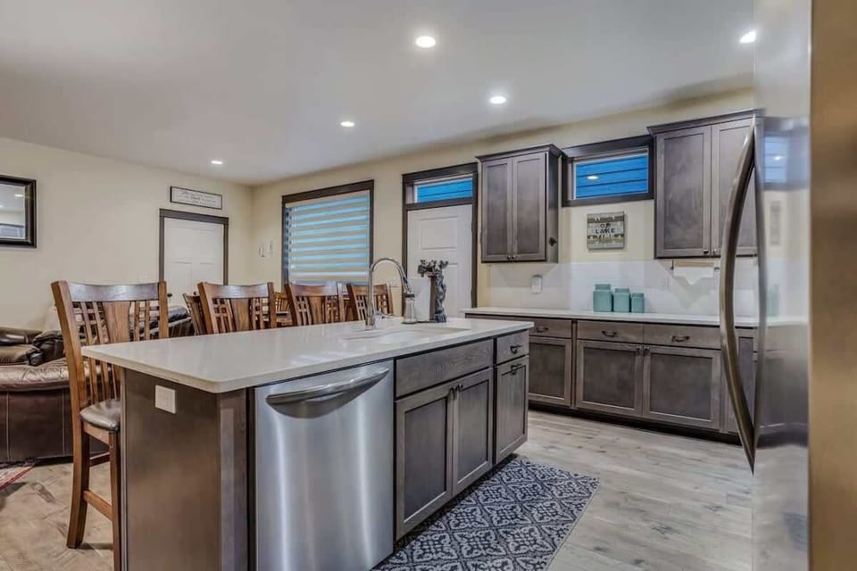 Your spacious gourmet kitchen invites culinary adventures with modern appliances, granite counters, and a large island perfect for gatherings.