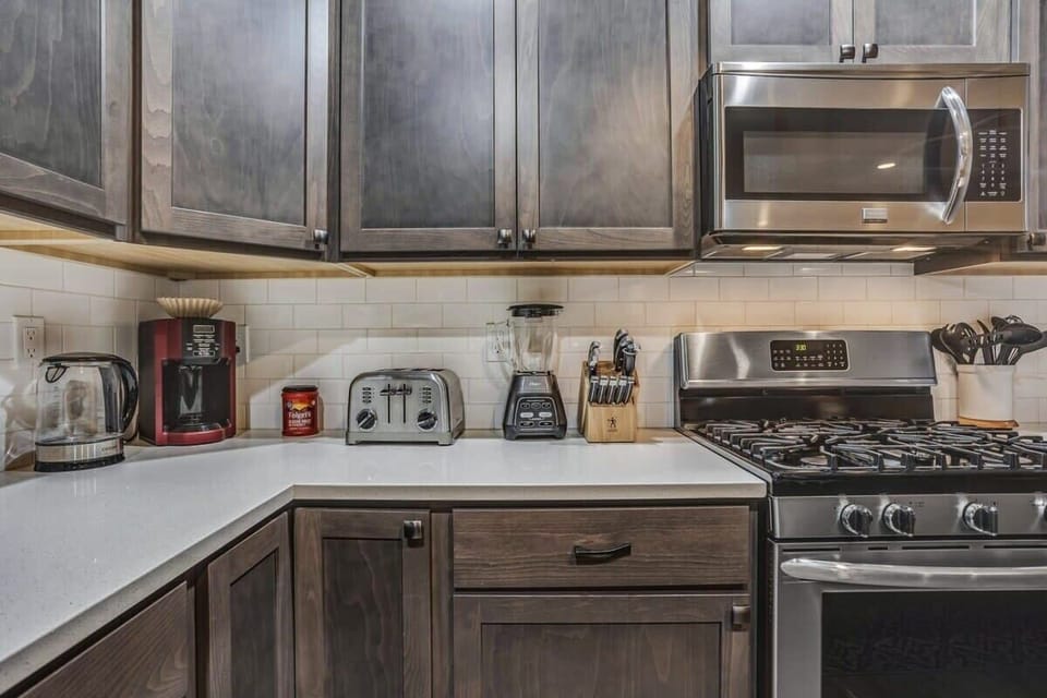Your fully equipped kitchen awaits with stainless steel appliances, granite counters, and everything you need to create memorable meals.