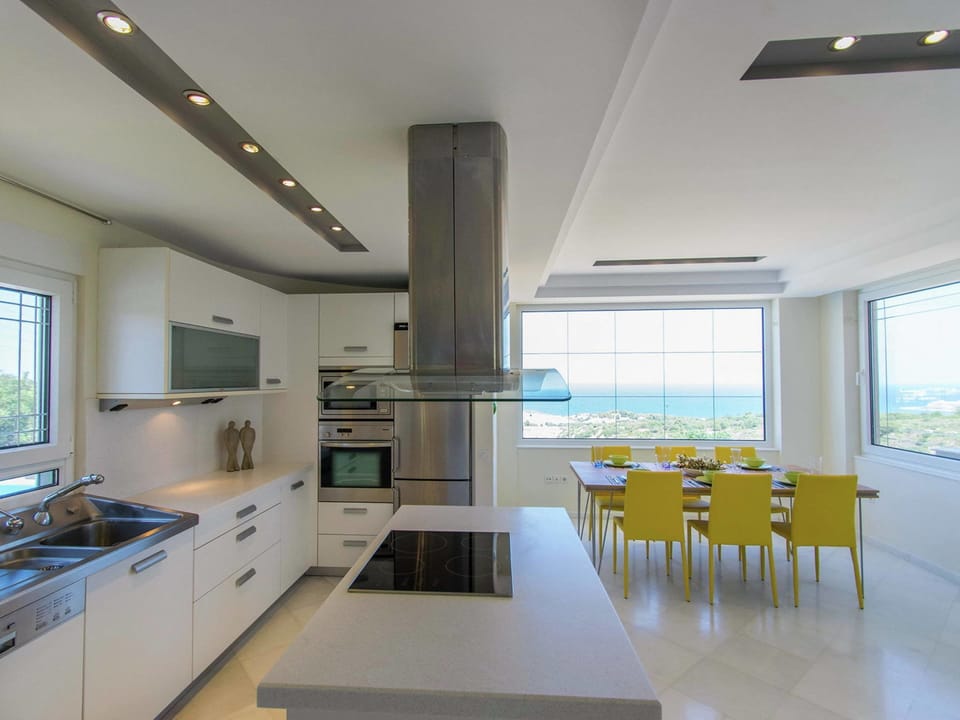 Villa | Private kitchen | Stovetop, electric kettle, toaster, highchair