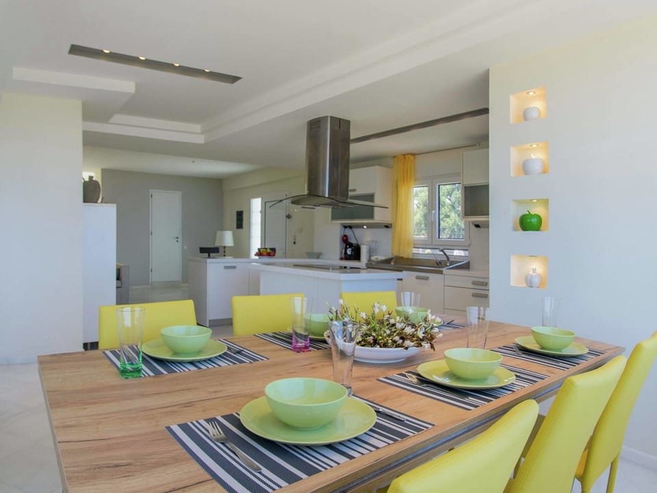 Villa | Private kitchen | Stovetop, electric kettle, toaster, highchair