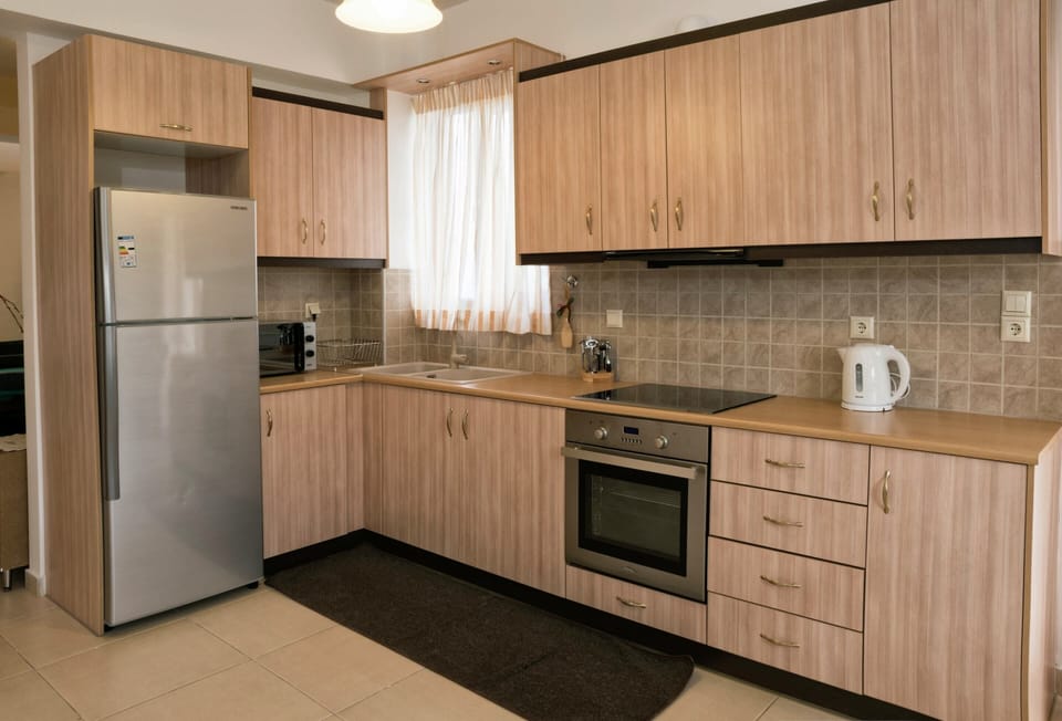 Villa | Private kitchen | Stovetop, coffee/tea maker, highchair, cookware/dishes/utensils