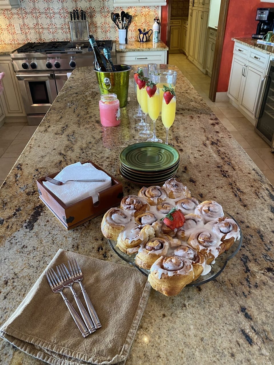 Our chef displaying Mimosas and Cinnamon rolls on Sunday morning.