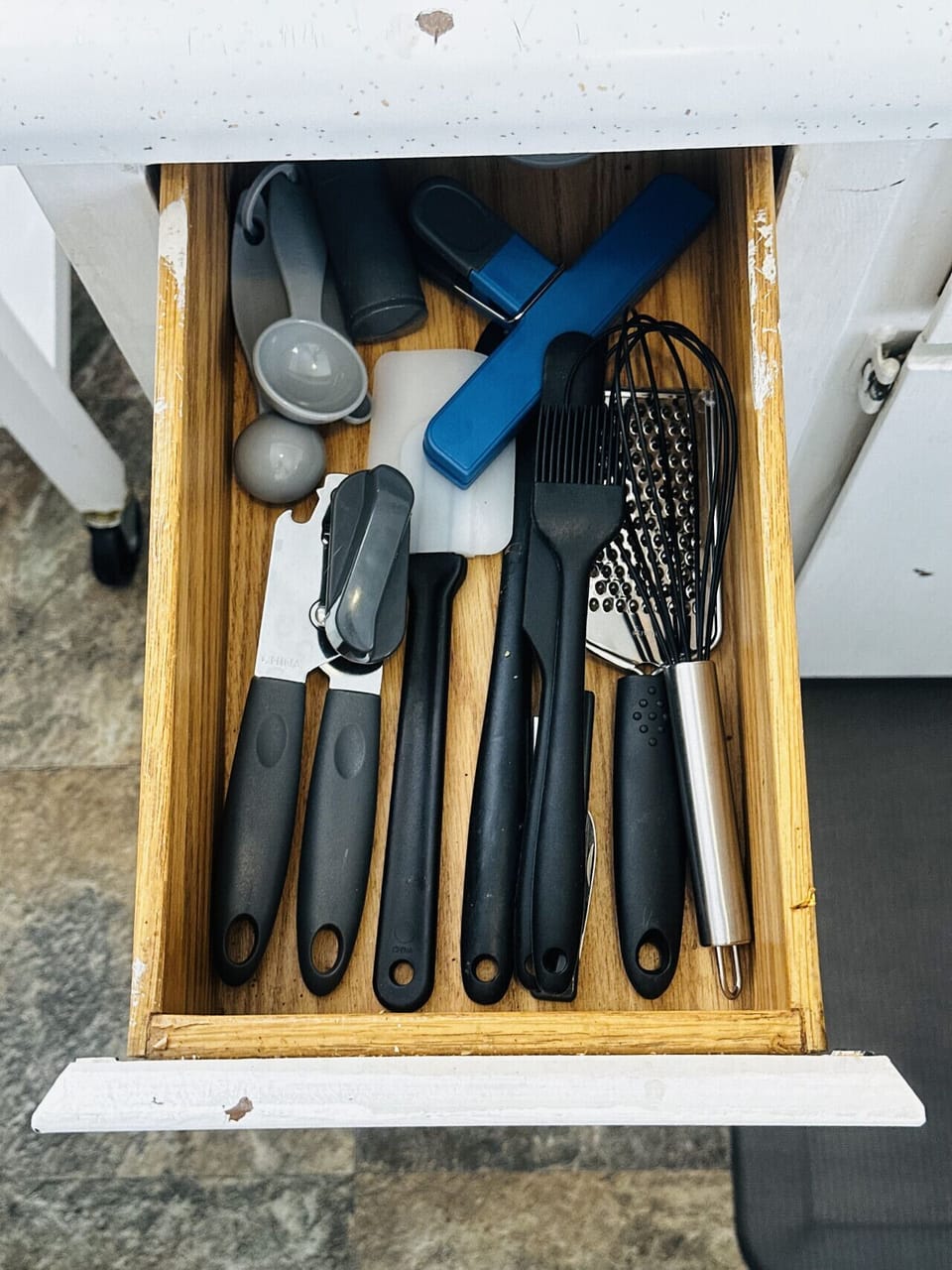 Convenient utensil drawer with cooking essentials for everyday meals.