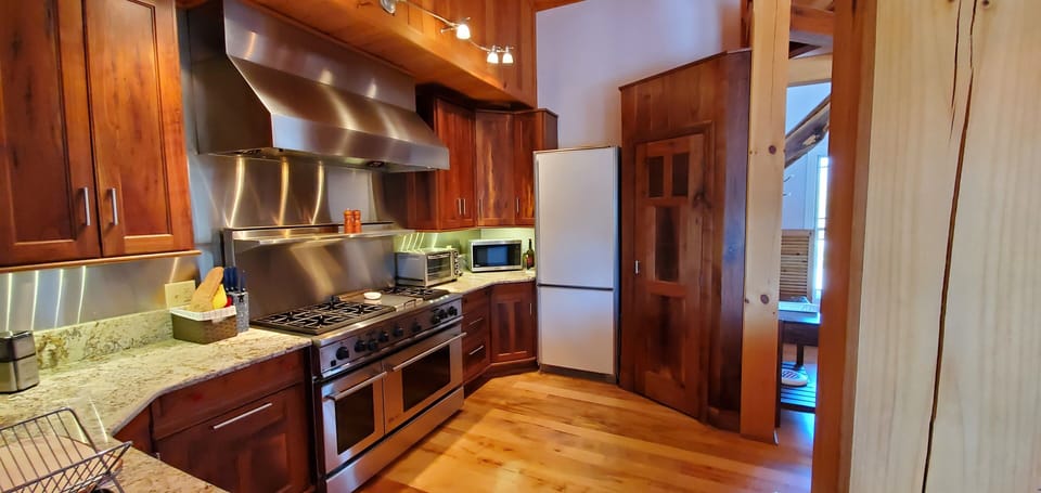 Full size fridge/freezer, pantry, microwave and toaster.
