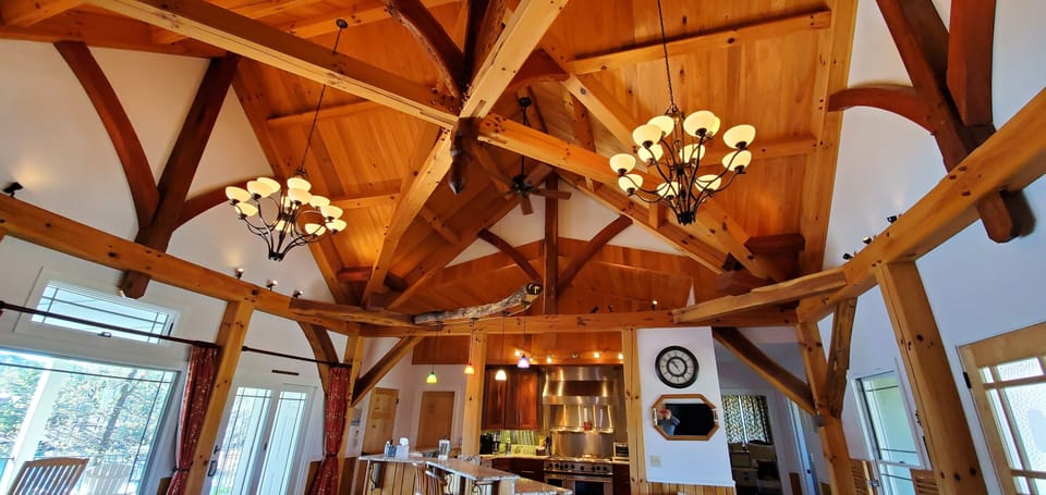 Upper level with custom craftsmen timber ceiling.
