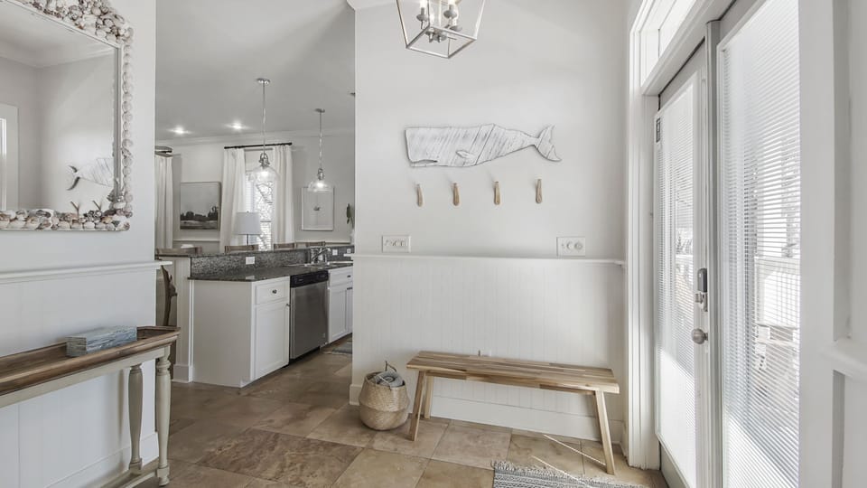 Entry foyer with plenty of hooks.