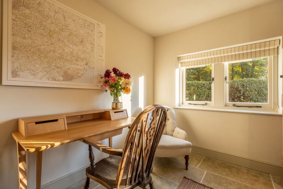 Ground floor: Study with writing desk adjacent to the open-plan sitting room and kitchen/dining room