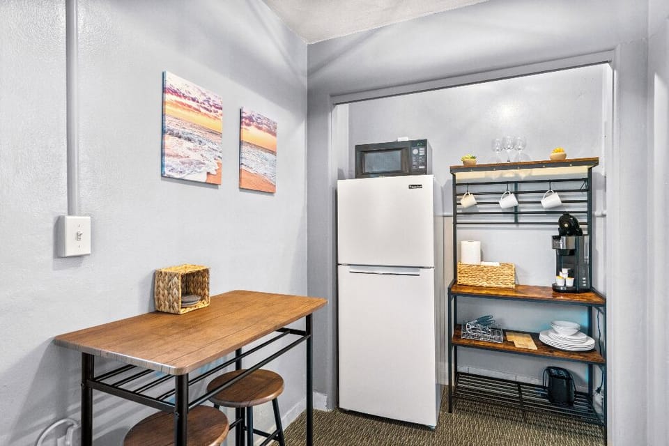 Boutique Beach Retreat open concept kitchenette, refrigerator/freezer, coffee bar, with kitchen basics, and seating area