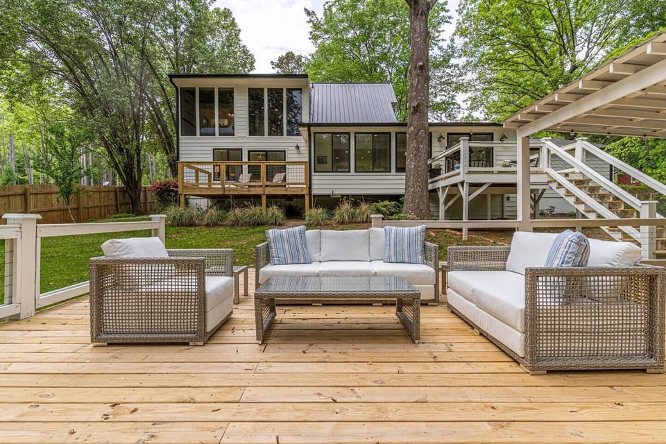 Enjoy views of the lake from the many deck landings and large floor to ceiling windows on the back of the lake house. This is also The perfect spot for happy hour!