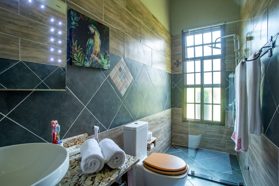 Family Suite, 2 Bedrooms | Bathroom | Shower, free toiletries, hair dryer, bathrobes