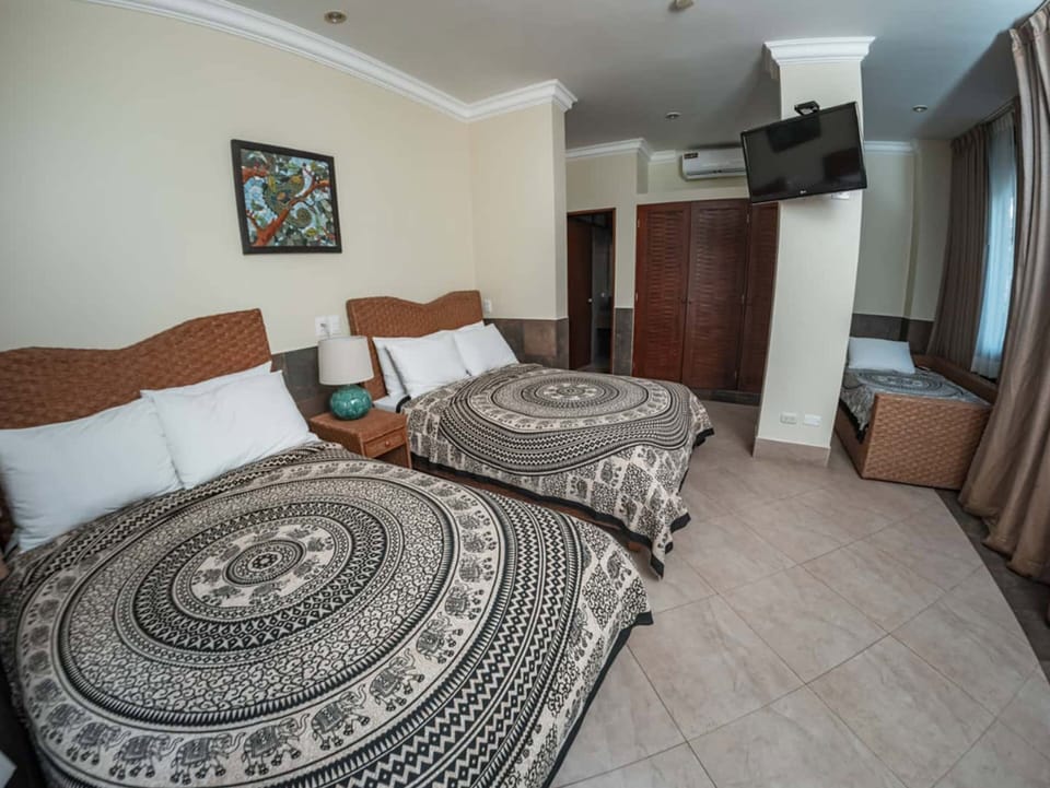 Family Room | Down comforters, in-room safe, desk, blackout drapes