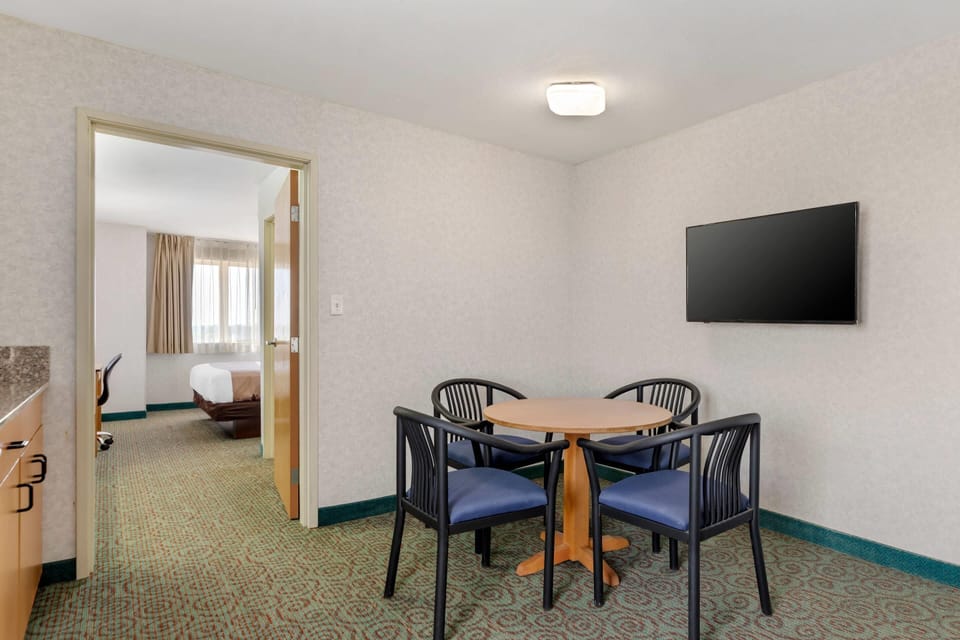 Desk, laptop workspace, blackout drapes, iron/ironing board