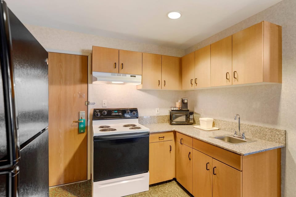Suite, 1 King Bed, Non Smoking, Kitchen | Desk, laptop workspace, blackout drapes, iron/ironing board
