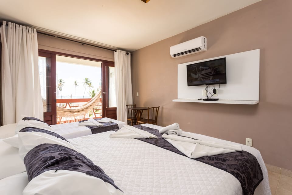 Standard Triple Room, Multiple Beds | Minibar, individually decorated, individually furnished, blackout drapes