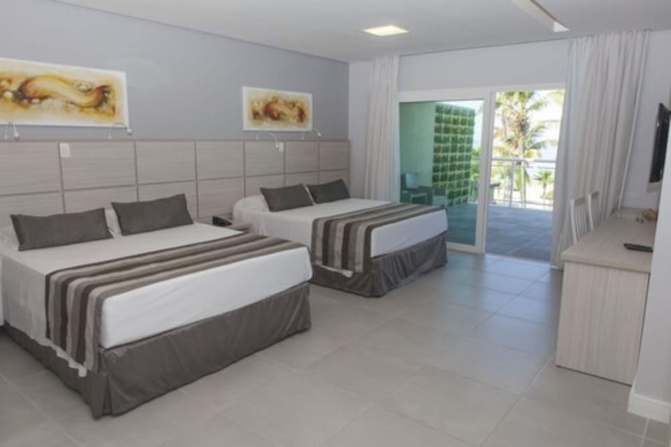 Premium Room, Oceanfront | Minibar, desk, free WiFi, bed sheets
