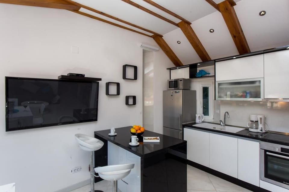 Apartment (2Bedroom Apt with sea view) | Private kitchen | Fridge, highchair, cookware/dishes/utensils