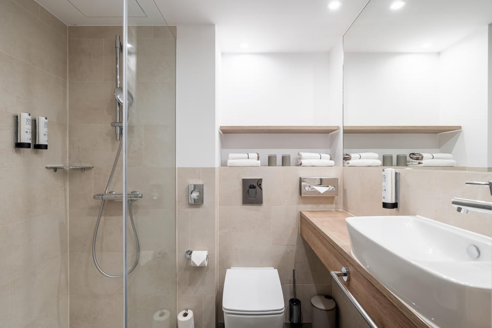 Standard Room | Bathroom | Shower, hair dryer, soap, toilet paper