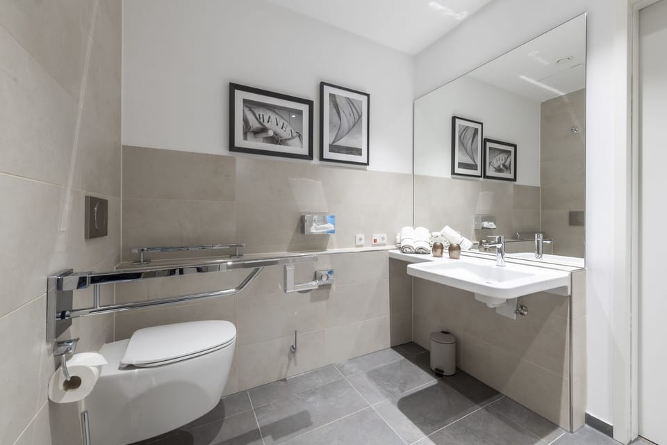Comfort Twin Room | Bathroom | Shower, hair dryer, soap, toilet paper