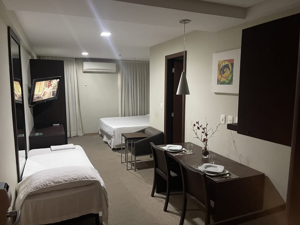 Standard Triple Room | Minibar, in-room safe, desk, blackout drapes