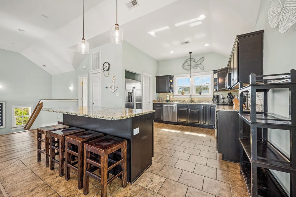 Kitchen with Bar Seating on Fourth Level