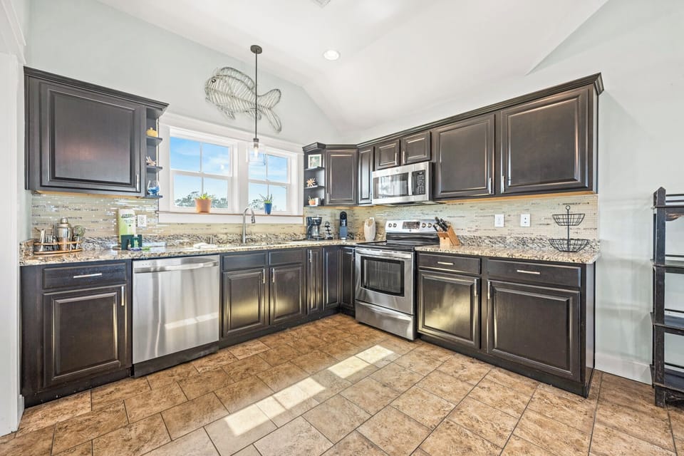 Kitchen with Bar Seating on Fourth Level