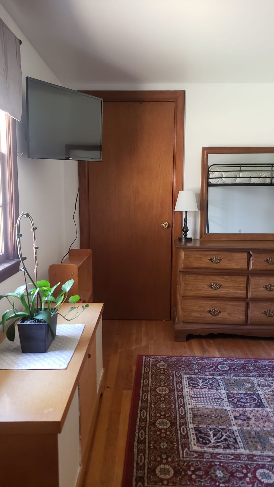 Bedroom#1 with smart TV on the wall.