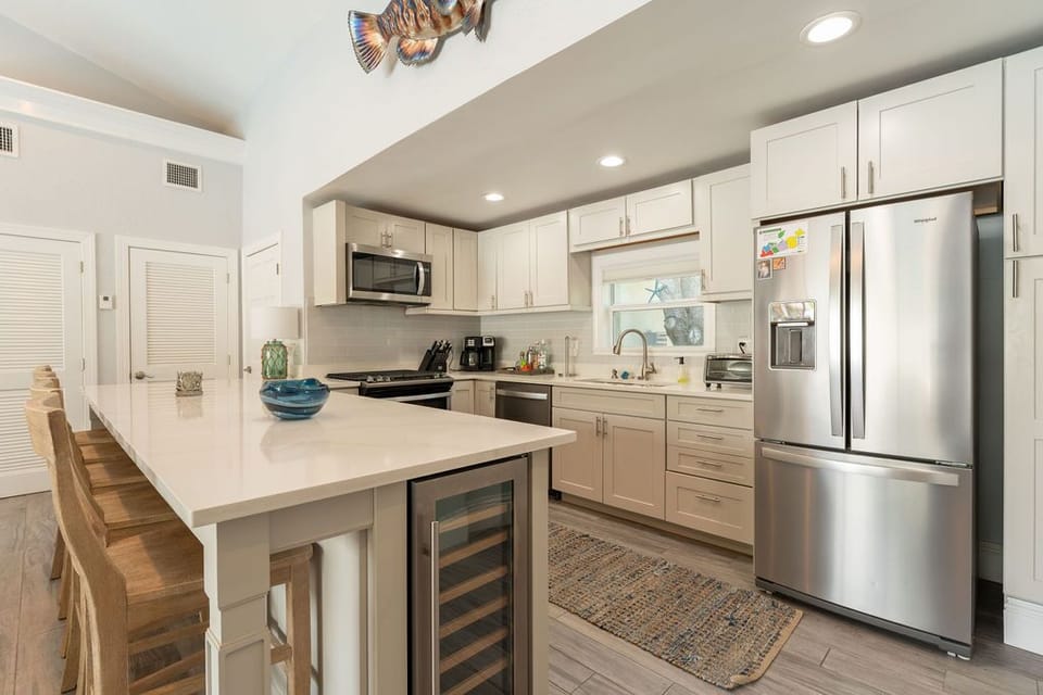 Well Appointed Kitchen with Stainless Appliances & Beautiful Quartz Counters