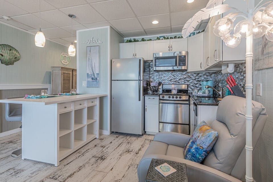Open kitchen equipped with the essentials of home including a dishwasher 